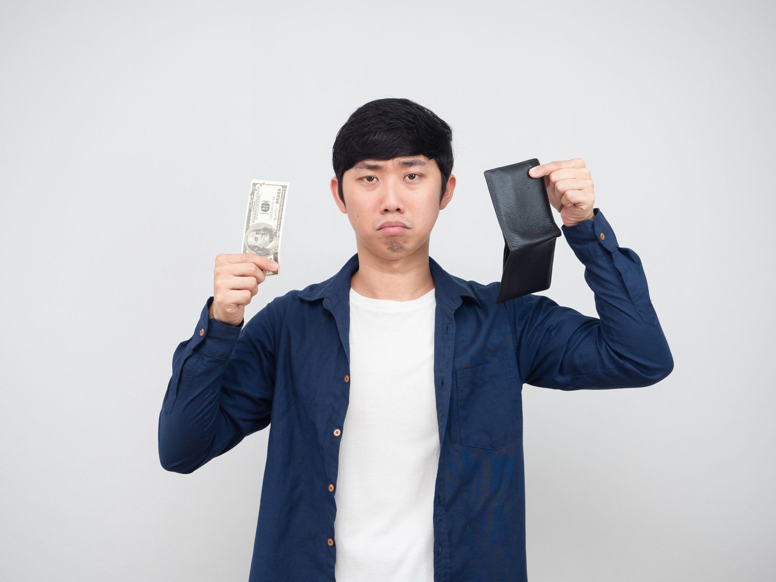 Investing-Awards-asian-man-holding-money-dollar-and-wallet-sad-face